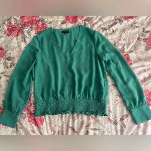 1. State Woman’s Low Cut Green Blouse